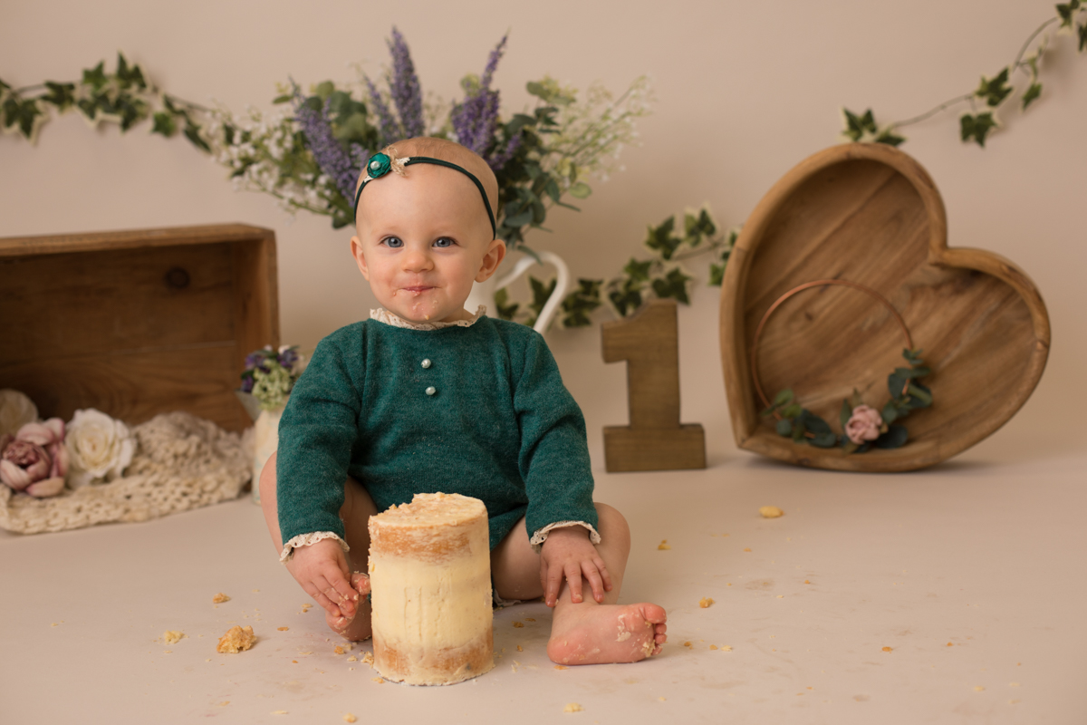 photo of one year old enjoying cake smash photo by beautiful bairns photography Edinburgh