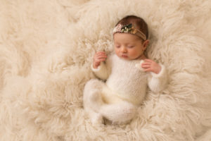 baby photo of baby girl in cream outfit on fluffy rug by professional newborn baby photographer beautiful bairns photography Edinburgh