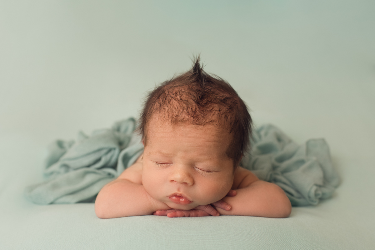 photo of newborn baby girl on turquoise blanket by professional newborn baby photographer beautiful bairns photography edinburgh