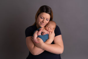 newborn baby being held by mum by edinburgh newborn photographer beautiful bairns photography