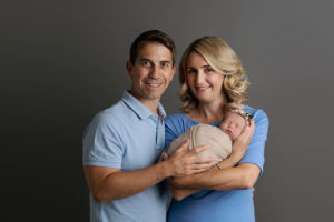 photo of parents holding newborn baby by newborn photographer edinburgh beautiful bairns photography
