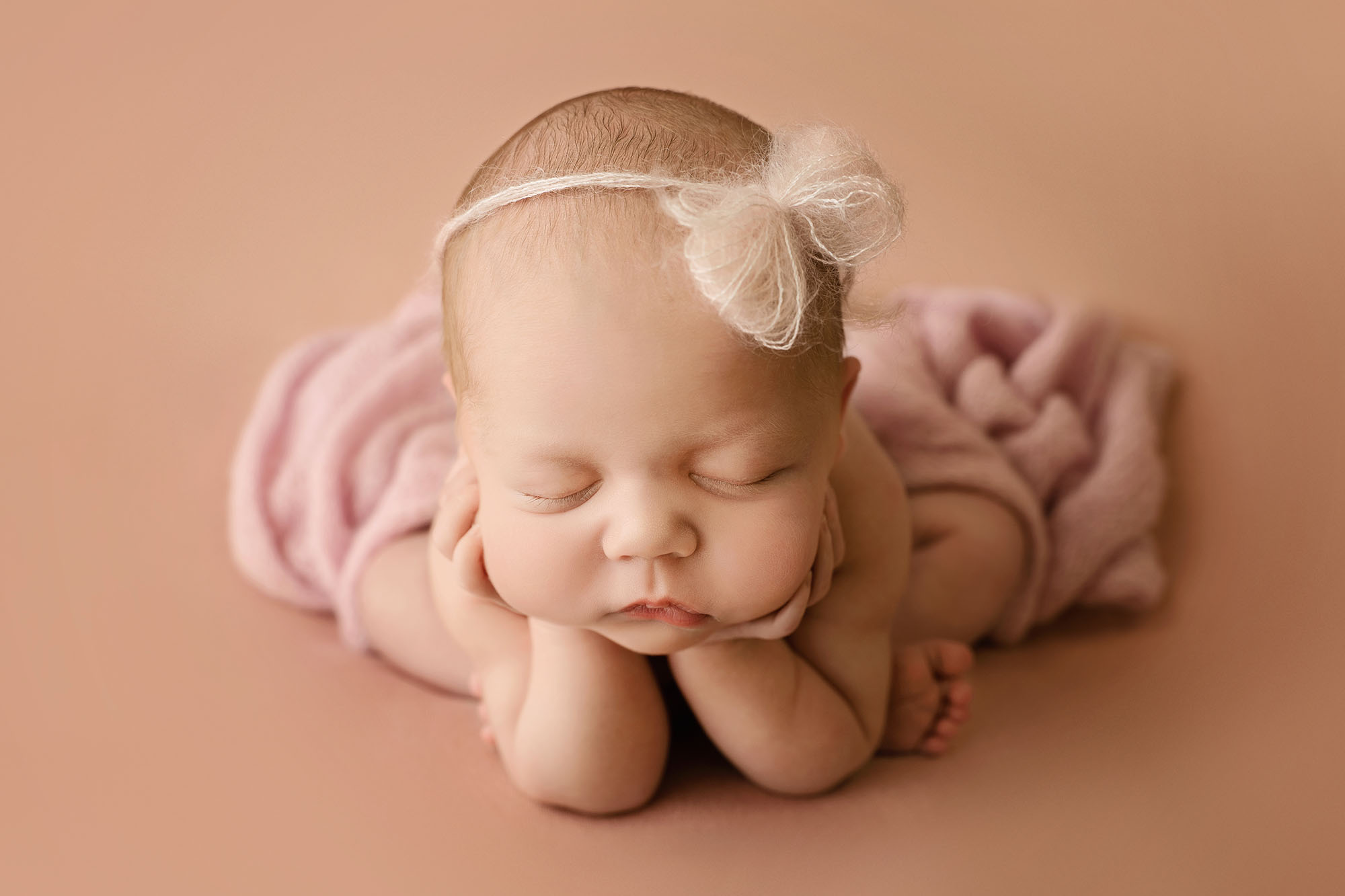 newborn baby girl in froggy pose by newborn photographer edinburgh
