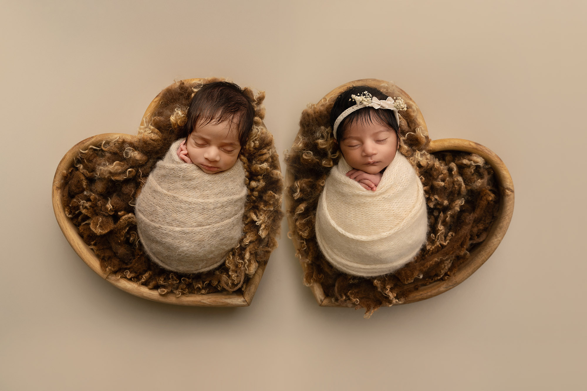 newborn twins wrapped and posed in heart shaped bowls by Newborn photographer Edinburgh