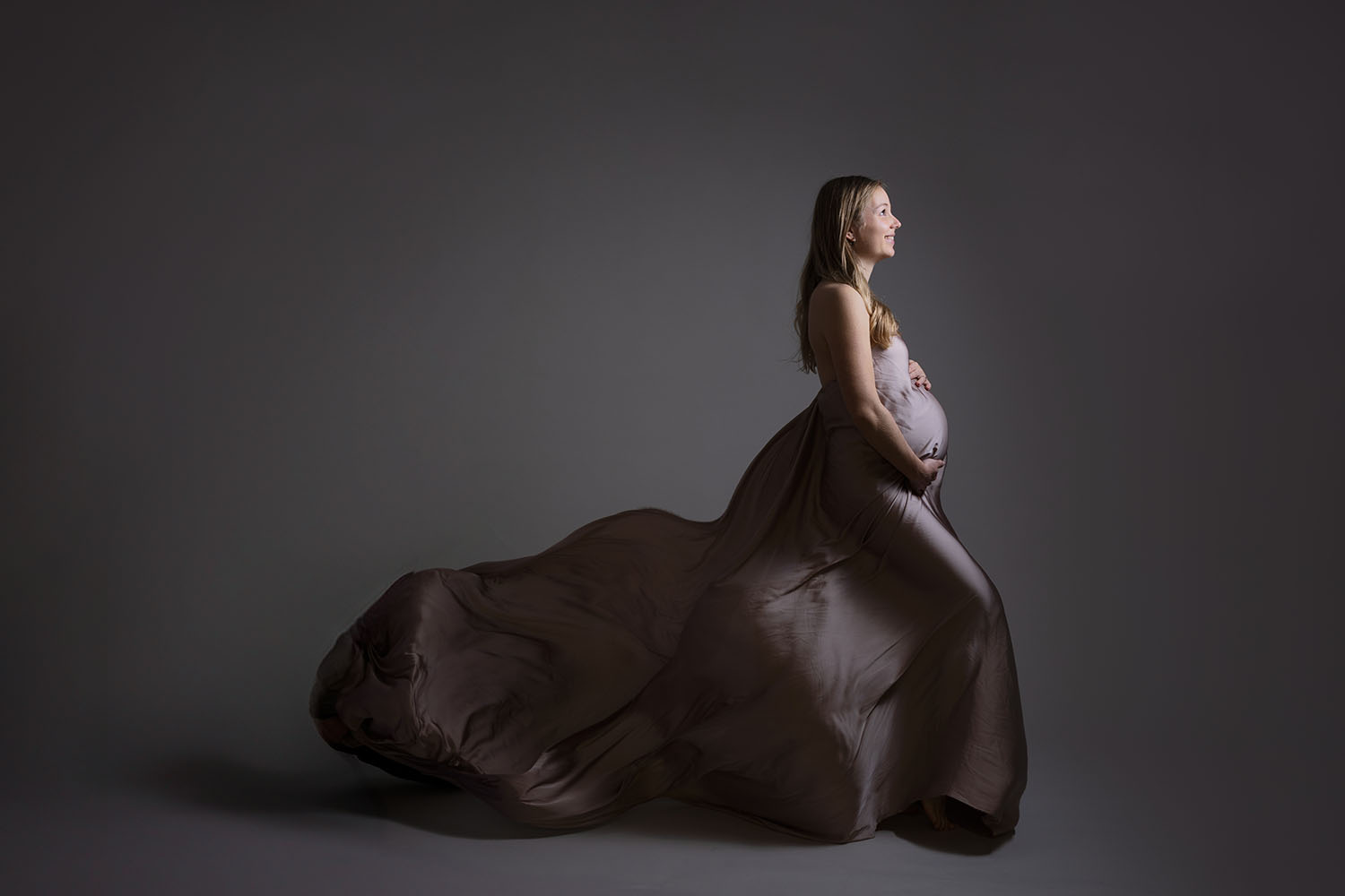 Petra posing elegantly for her maternity photoshoot in Edinburgh, Scotland