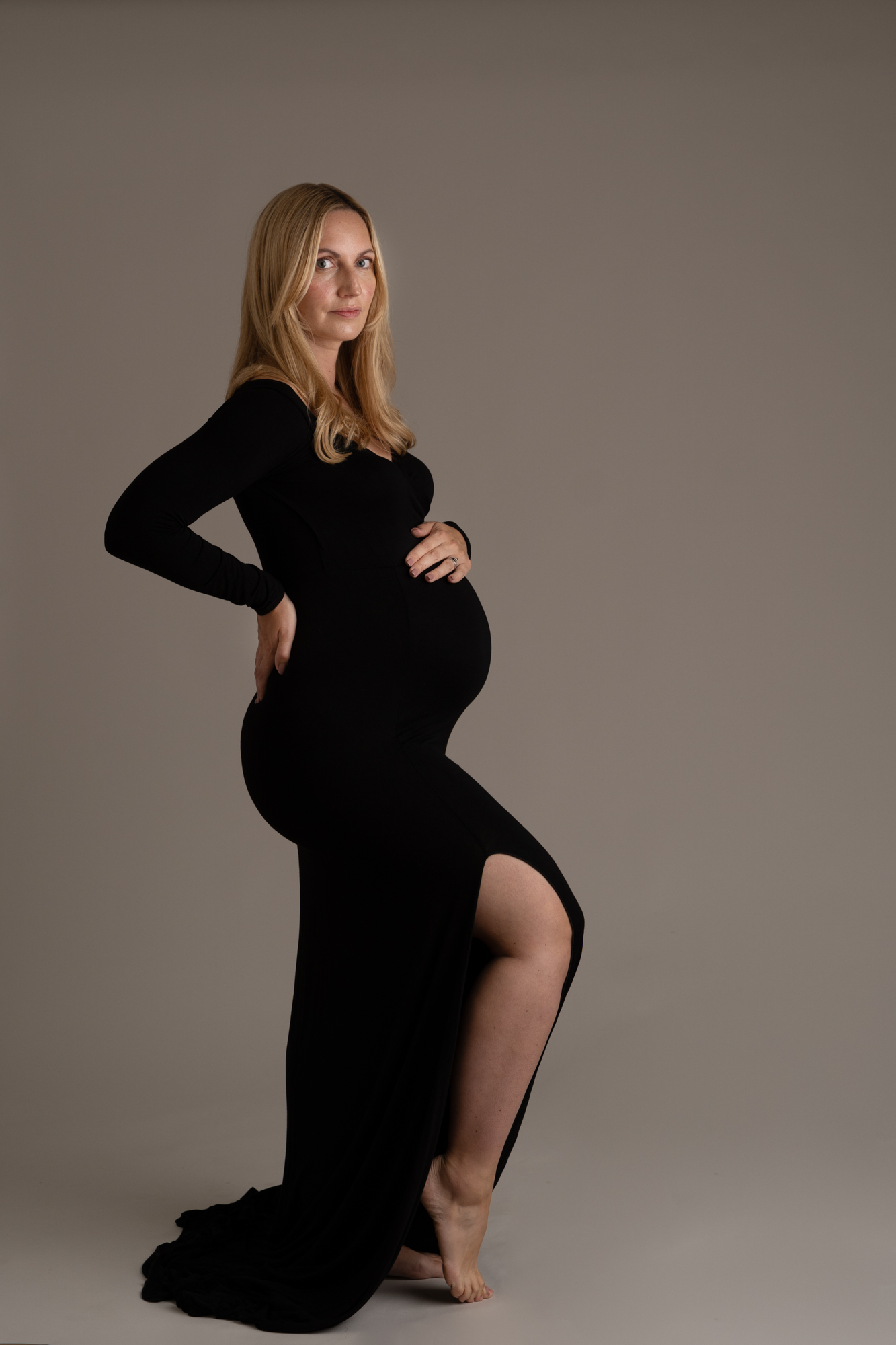 maternity photoshoot image of pregnant woman wearing a black dress by edinburgh maternity photographer beautiful bairns photography