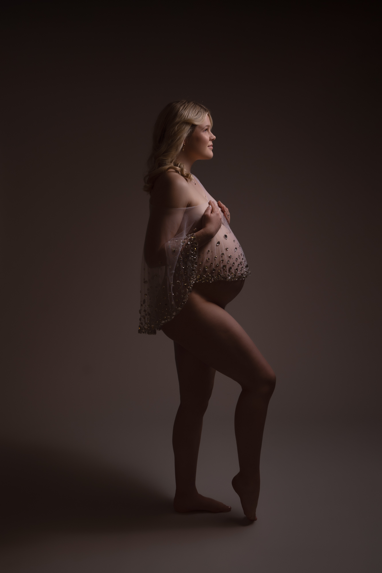 maternity photoshoot image of pregnant woman with crystal cape over her bump by edinburgh maternity photographer beautiful bairns photography